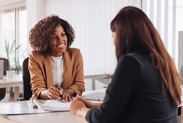 Woman consulting with a female financial manager at the bank