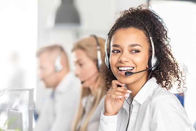 Call center worker accompanied by her team