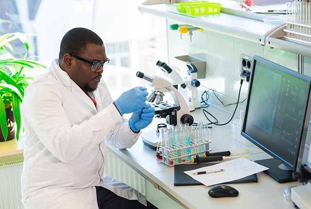 African-American scientist working in lab
