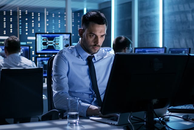 employee focused working on his computer