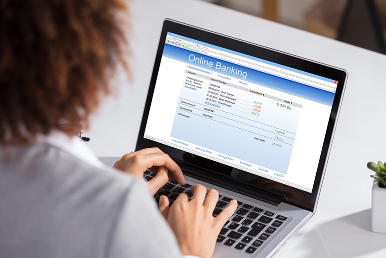 woman typing on laptop