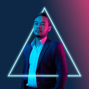 Business Man with glowing triangle on dark background