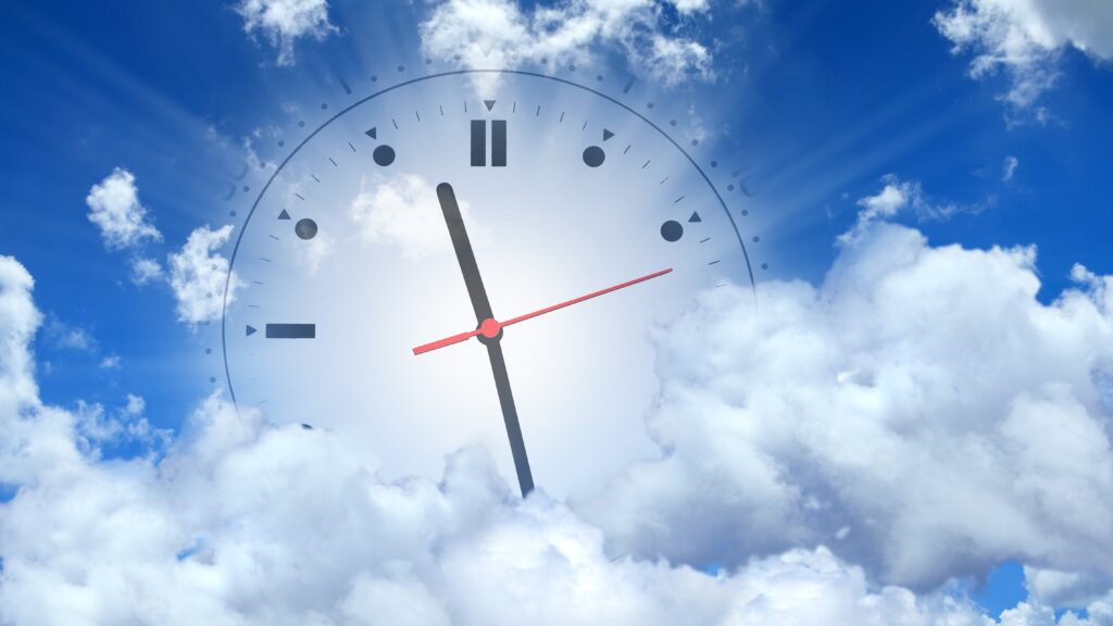 Feature image for time, entitlements and approvals cloud access blog post. Image is a clock superimposed into clouds against a blue sky backdrop.