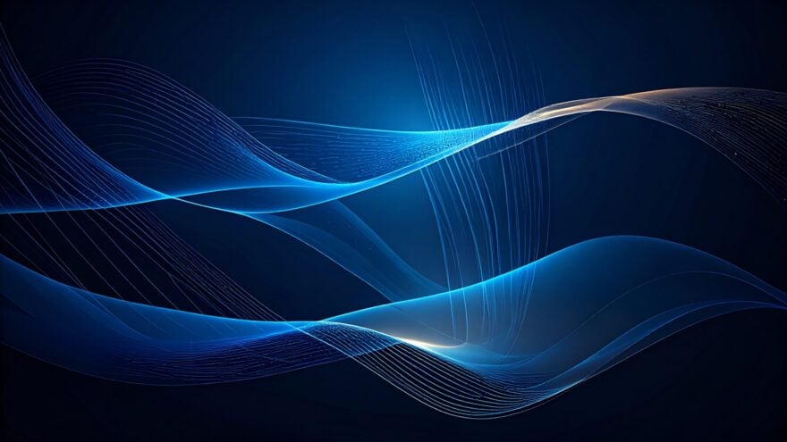 Abstract image featuring smooth, flowing blue and white light waves against a dark background, creating a sense of motion and fluidity.