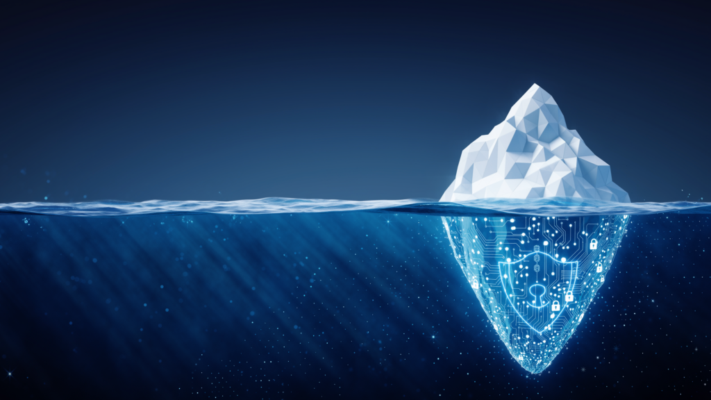 Iceberg above and below the waterline with a digital circuit‑patterned underside symbolizing hidden AI systems and identity security risks.