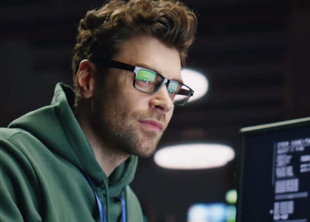 Guy with big hair and glasses