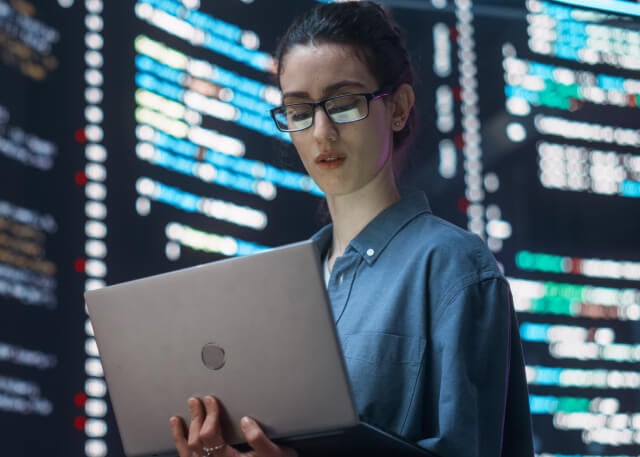 Woman looking at laptop